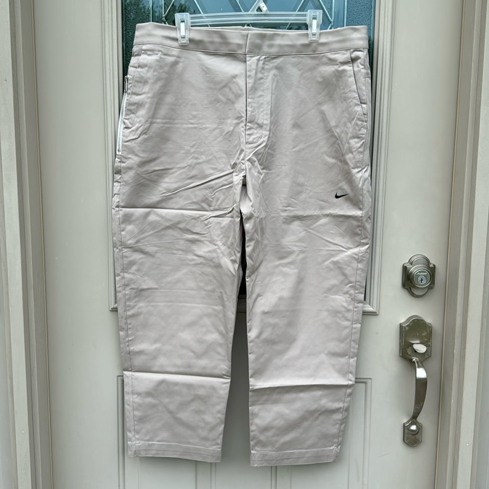 Brand new Nike men’s pant standard fit taper leg sneaker length khaki size 38.